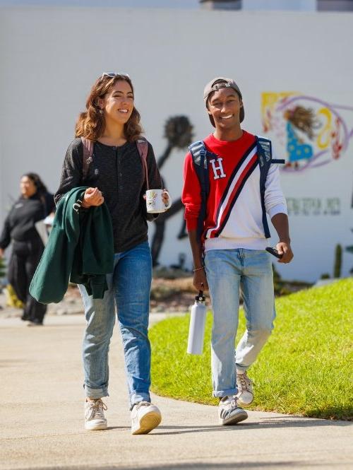 Two students walk to class